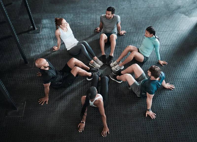 group-circle-sit-ups-training-workout-exercise-gym-class-club-core-fitness-challenge-people-personal-trainer-friends-collaboration-weight-loss-endurance-health